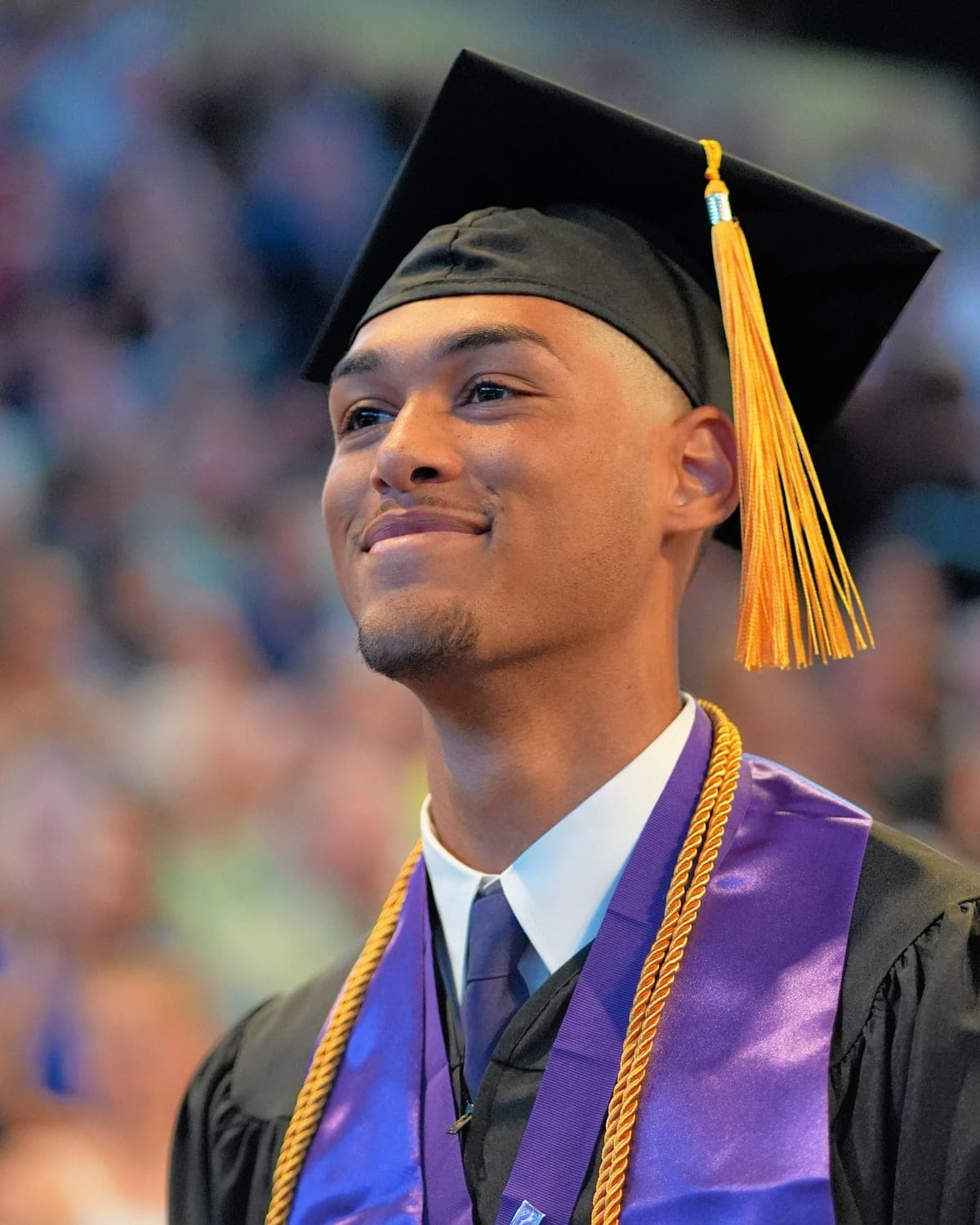 Isaiah, the founder of Maren, at his college graduation in cap and gown.
